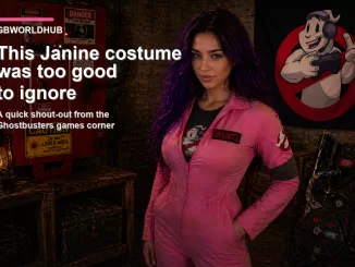 Dana Mercer wearing a pink Janine-inspired Ghostbusters jumpsuit with large round glasses, dark elbow-length gloves, a black belt, and black boots, posing indoors against a softly lit neutral wall.